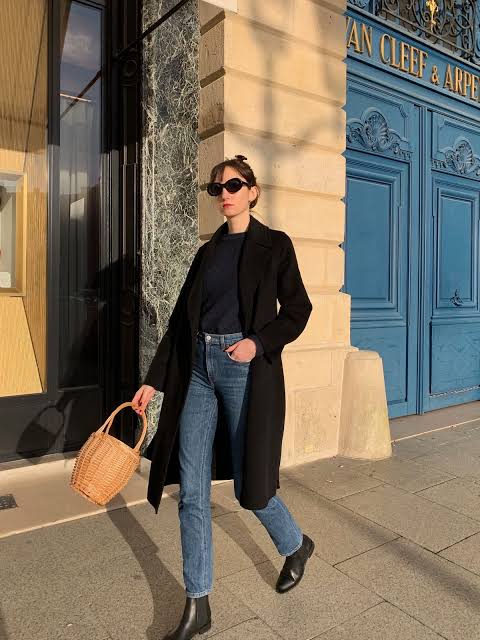 Long Black Coat with Navy Sweater, Jeans, and Straw Tote Long Black Coat with Navy Sweater, Jeans, and Straw Tote — Paris Winter Outfits