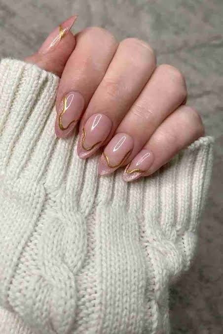 Thin Gold Lines And Glitter Accents Visual Idea Thin Gold Lines And Glitter Accents Visual Idea — Winter Nude Nails