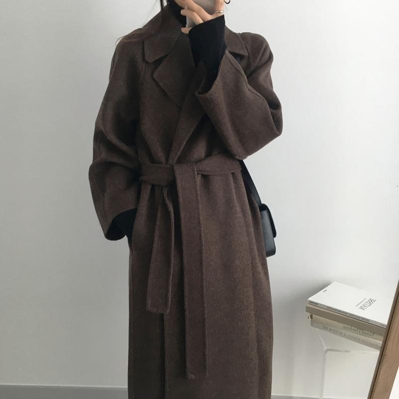 Timeless Polish: Brown Belted Wool Coat Over Black Turtleneck Timeless Polish: Brown Belted Wool Coat Over Black Turtleneck — Dressy Winter Outfits