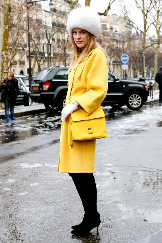 Striking Contrast: White Fur Hat with Yellow Coat Striking Contrast: White Fur Hat with Yellow Coat — Fur Hat Outfits