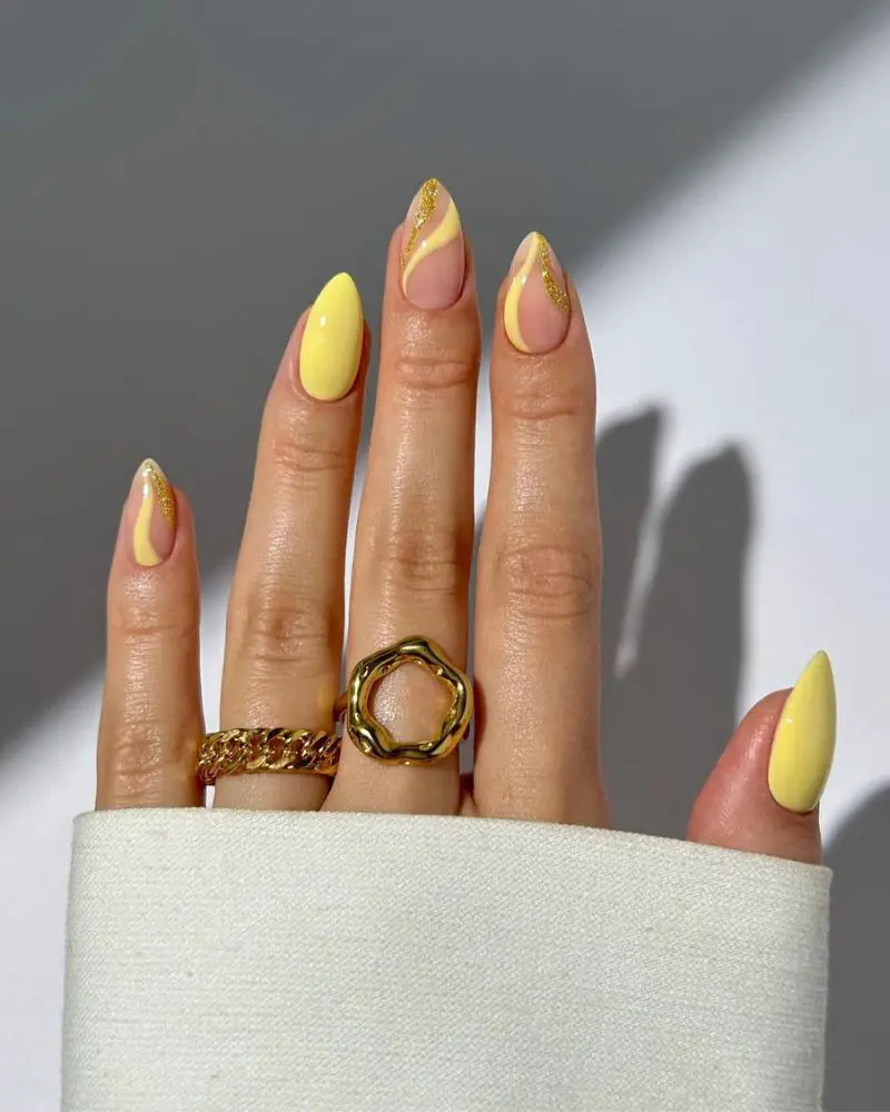 Vibrant Yellow Swirls with Gold Glitter Vibrant Yellow Swirls with Gold Glitter — Yellow Nail Designs