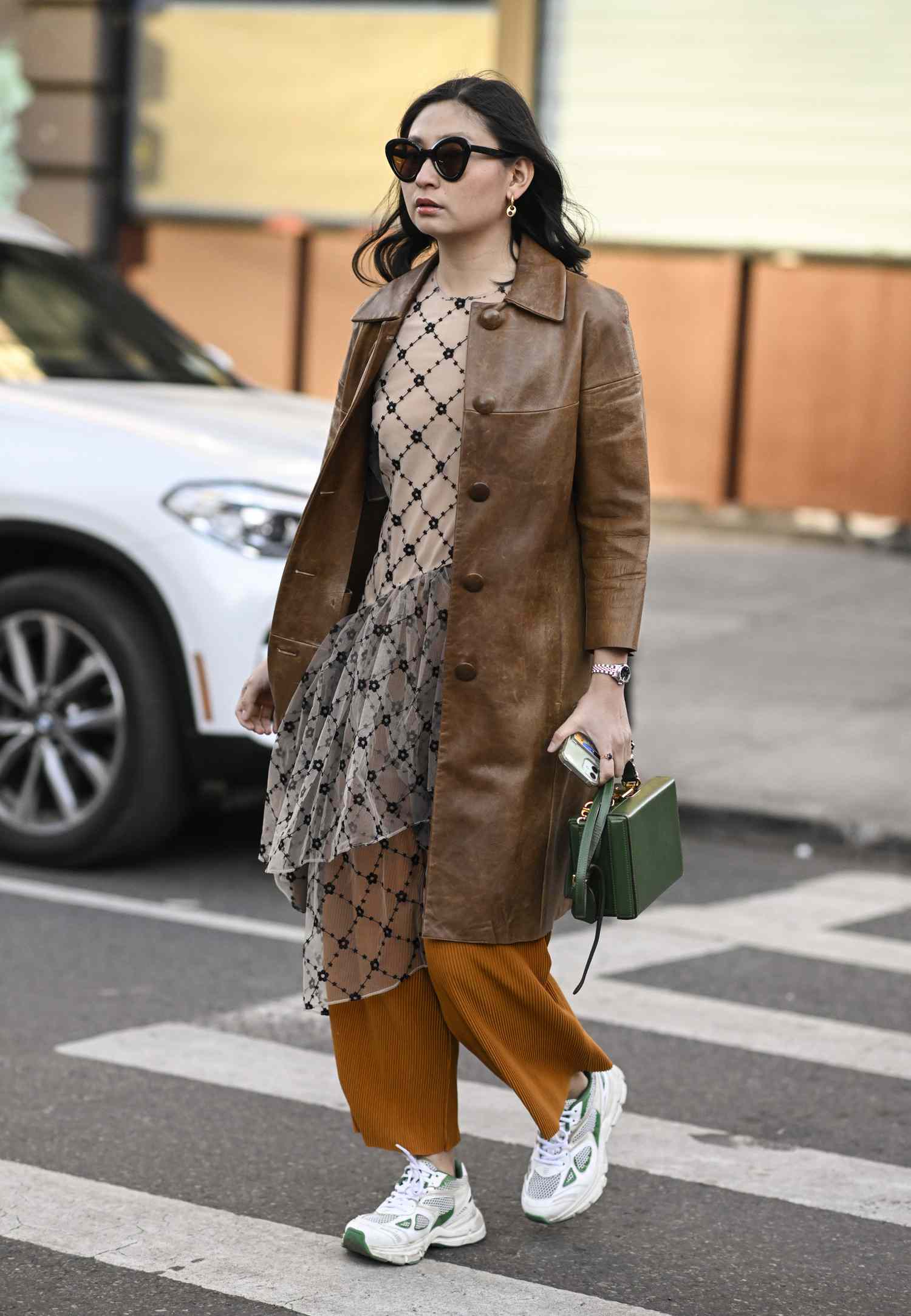 Edgy Brown Leather Coat with Patterned Dress and Orange Trousers Edgy Brown Leather Coat with Patterned Dress and Orange Trousers — Brown Coat Outfits