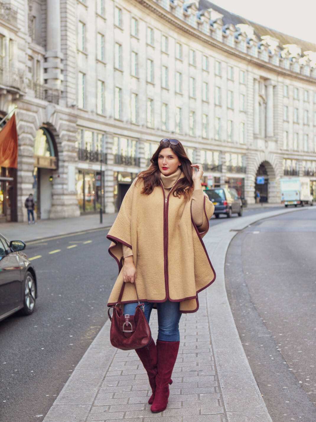 Beige Poncho with Burgundy Accents for City Exploration — London Winter Outfits