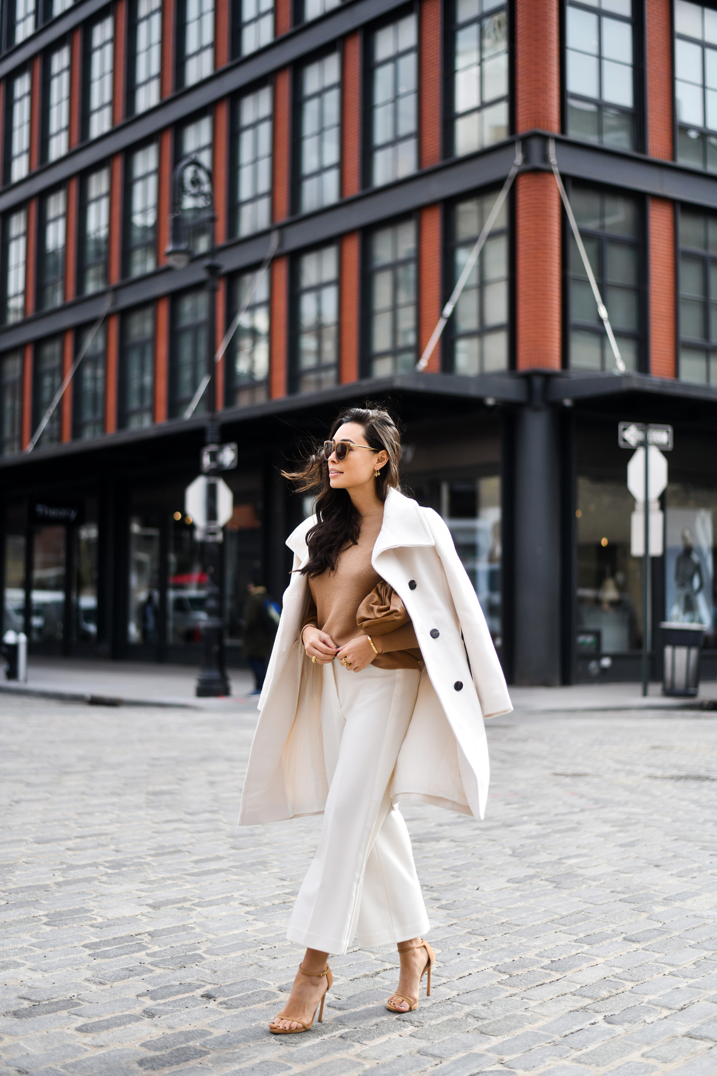Chic Cream Coat Over White Trousers and Tan Knit — Winter White Outfits