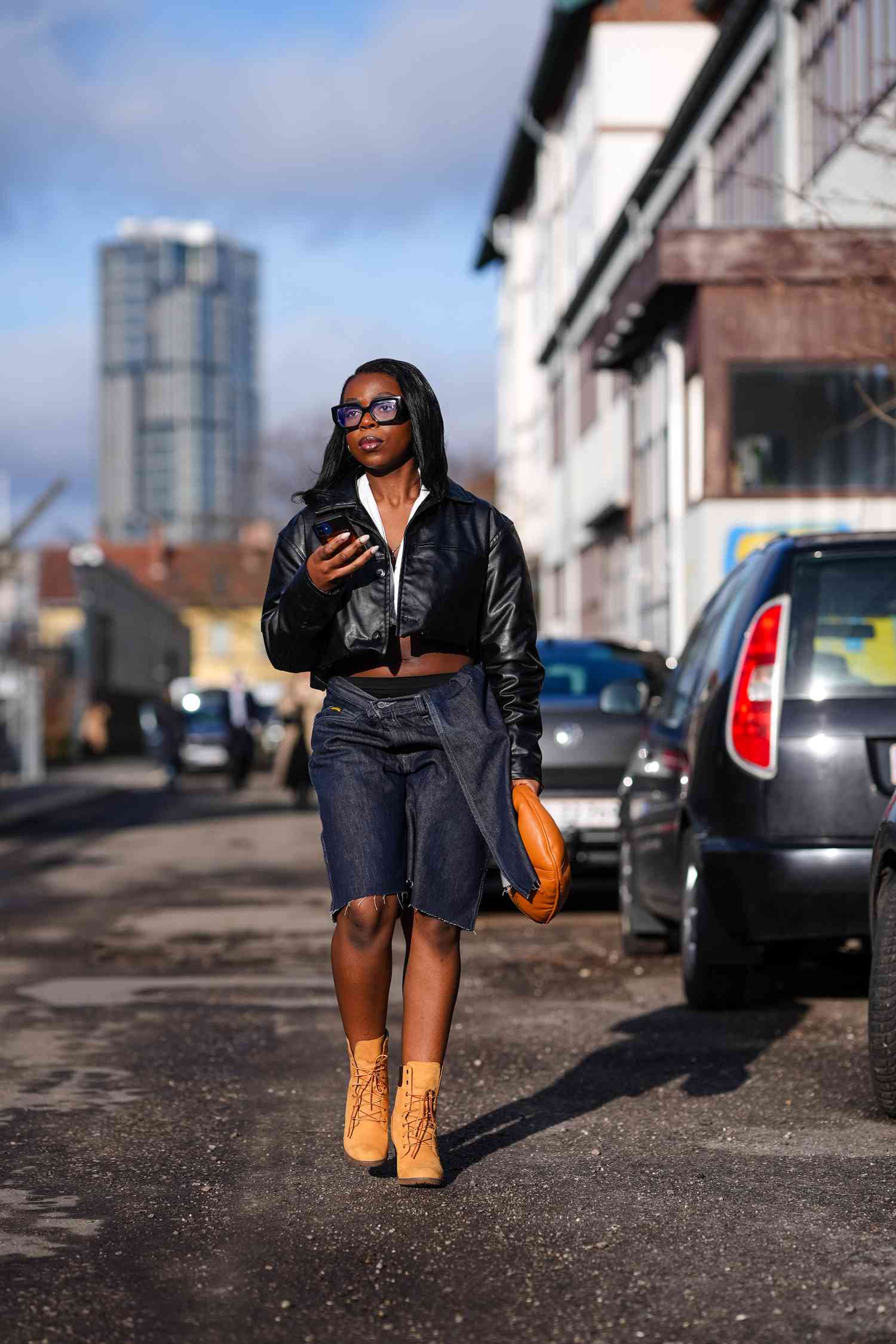 Urban Edge: Tan Timberlands with Leather Jacket and Denim Shorts — Timberland Boots Outfits
