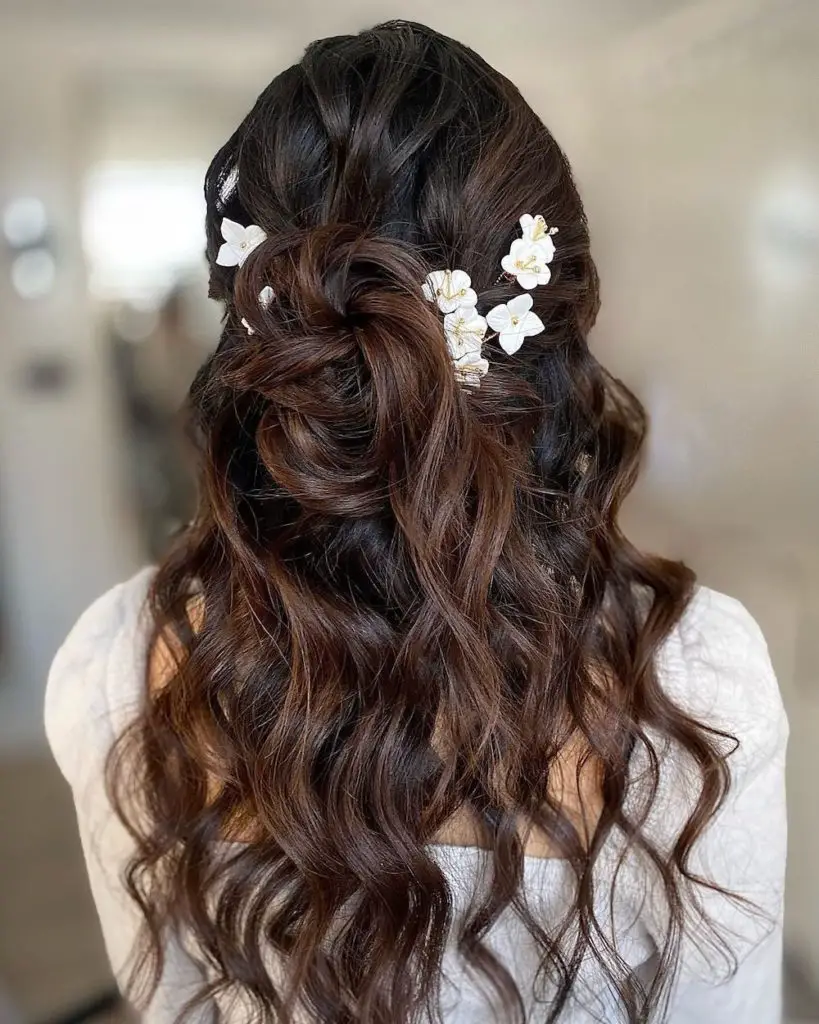 Dark Brown Bun With Flowers Dark Brown Bun With Flowers — Winter Half Up Half Down Hairstyles