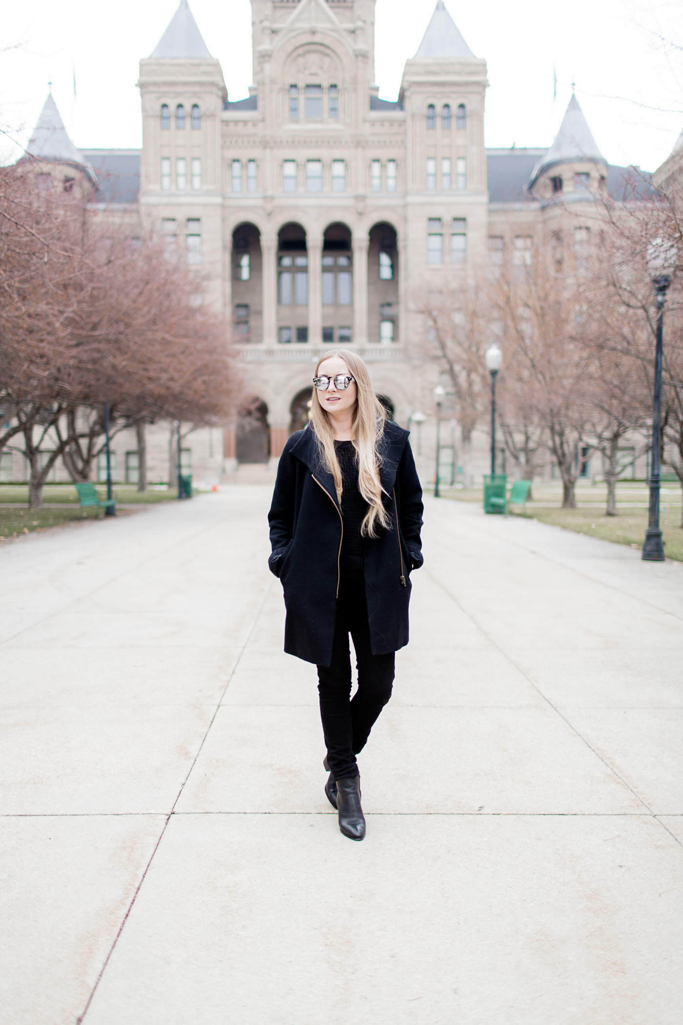 Classic Black Wool Coat Over Knit Sweater and Pants — All Black Winter Outfits