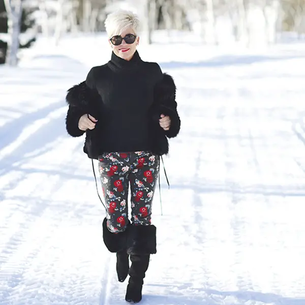 Black Fur-Trimmed Jacket with Floral Pants and Fur Boots — Casual Winter Outfits for Women Over 50