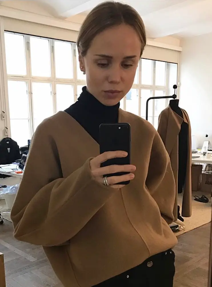 Oversized Camel V-Neck Sweater Over Black Turtleneck — Scandinavian Winter Outfits
