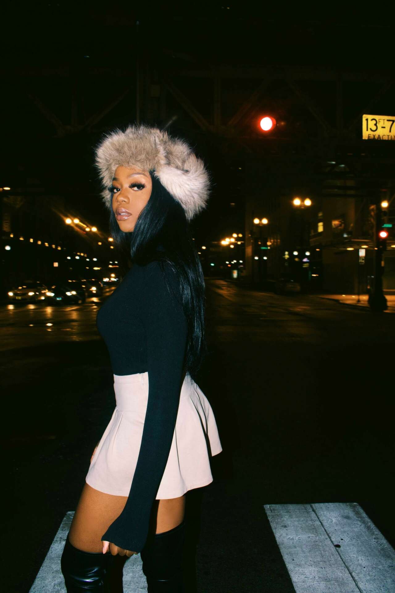 Faux Fur Hat and Knee-High Boots Elevate a Mini Skirt Ensemble Faux Fur Hat and Knee-High Boots Elevate a Mini Skirt Ensemble — Winter Club Outfits