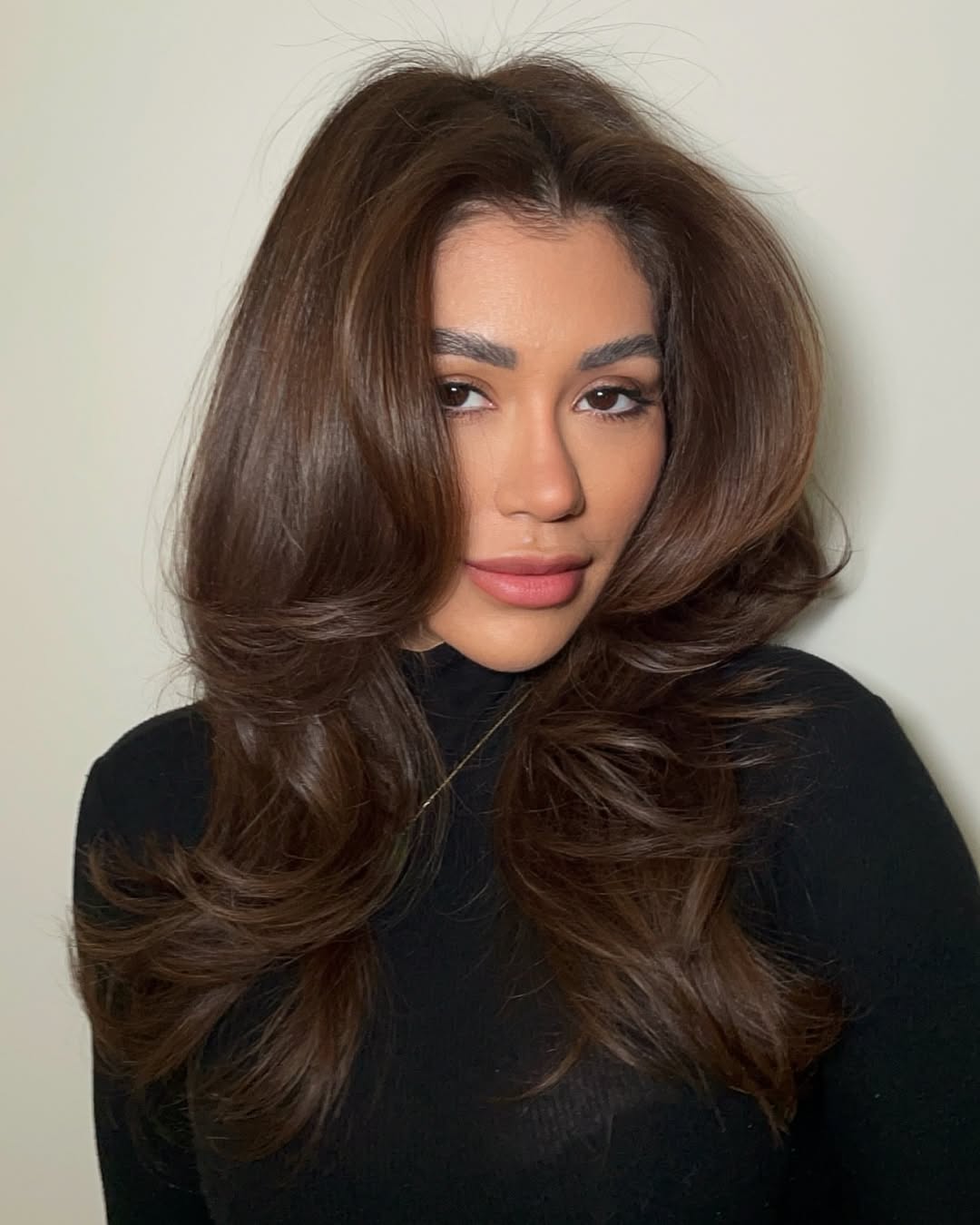 Voluminous Layered Brown Hair with Black Turtleneck Voluminous Layered Brown Hair with Black Turtleneck — Trendy Haircuts for Women