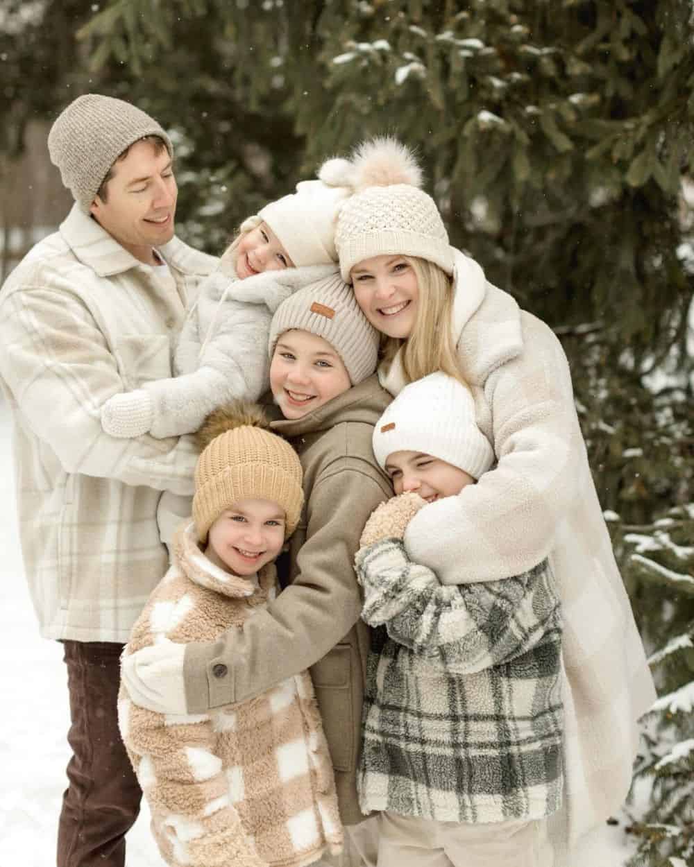 Coordinated Cream and Beige Winter Layers with Fuzzy Hats — Winter Family Photo Outfits