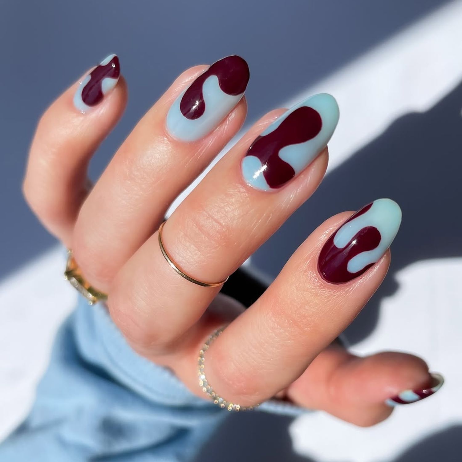 Medium Oval Light Blue Burgundy Waves — Simple Nail Designs