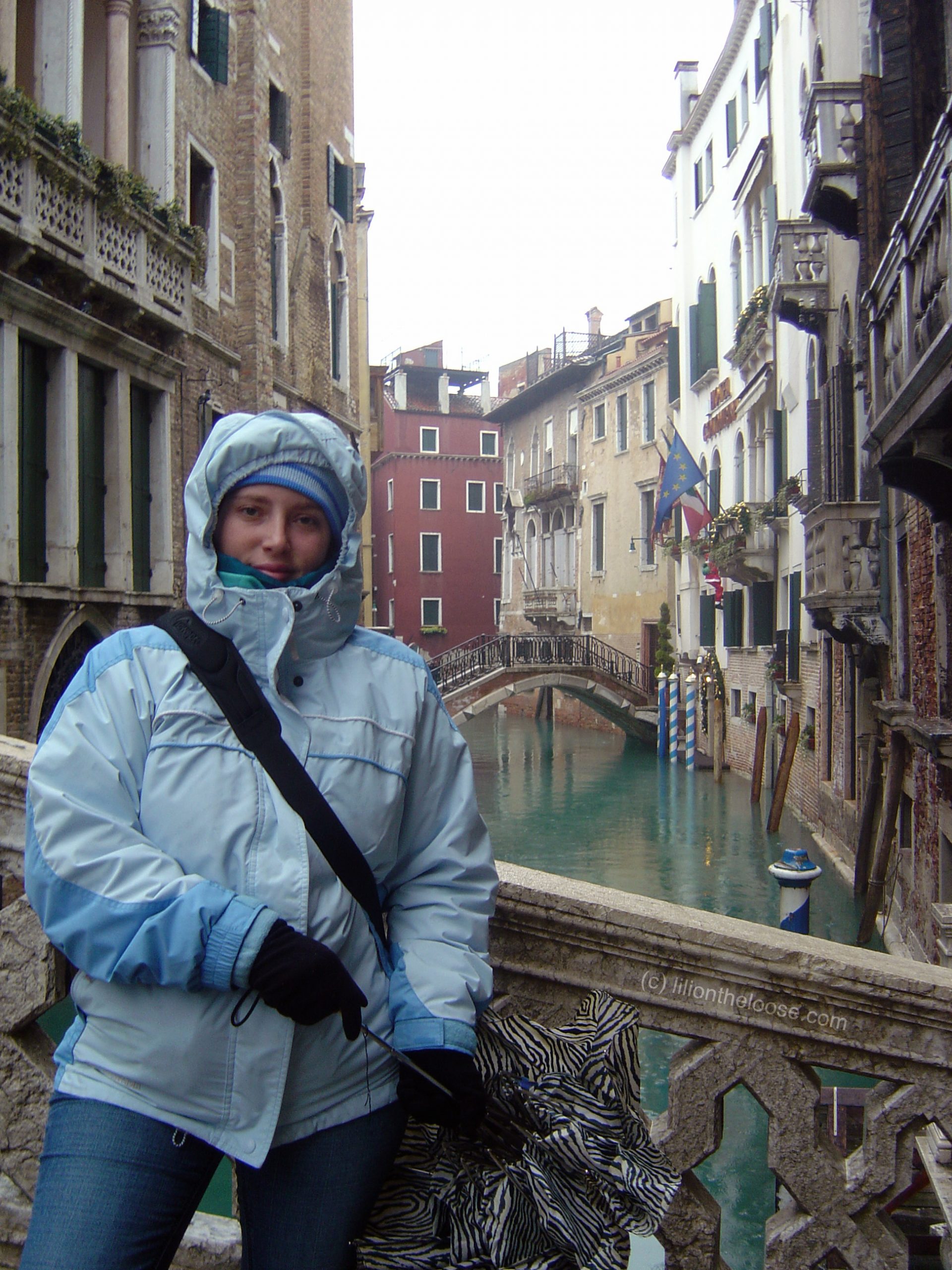 Blue Hooded Puffer Jacket for Winter Travel — Italy Winter Outfits