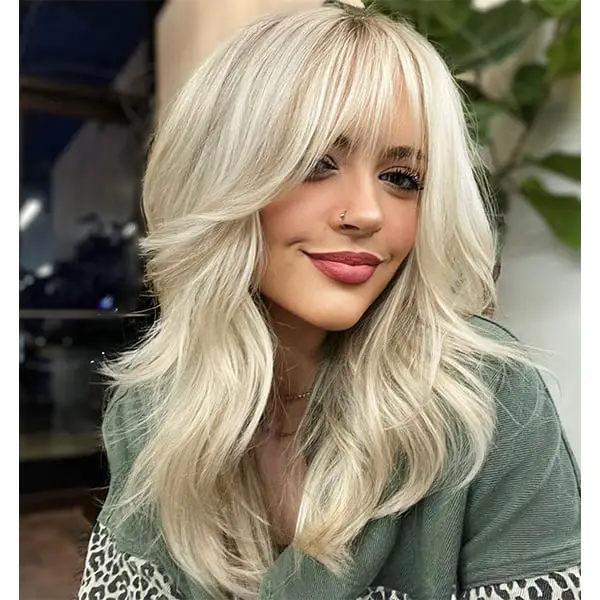 Collarbone Shag With Voluminous Bangs Collarbone Shag With Voluminous Bangs — Winter Haircuts with Bangs