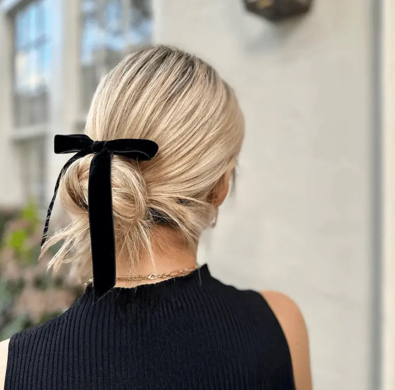 Low Bun With Black Velvet Bow — Winter Party Hairstyles