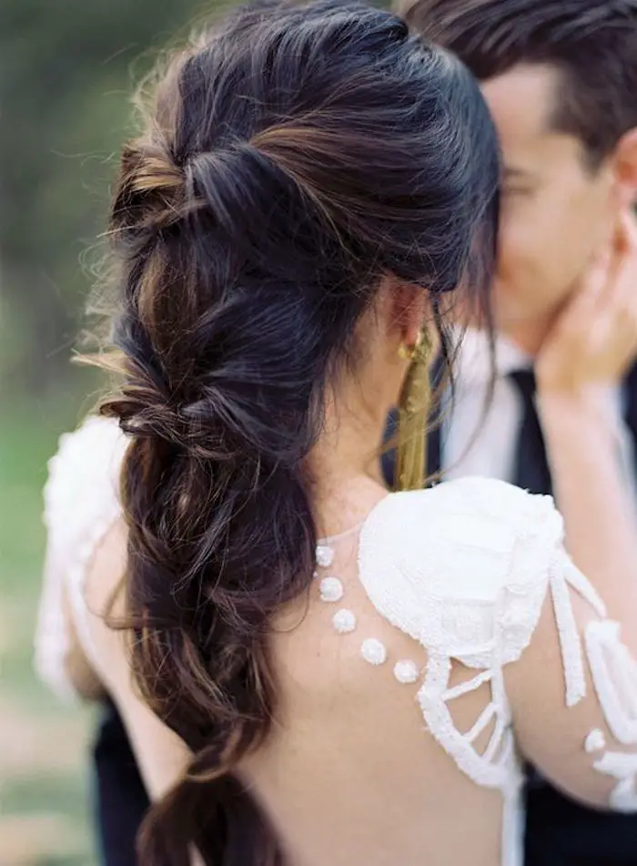 Blonde Chignon With Floral Accessory Blonde Chignon With Floral Accessory — Winter Wedding Hairstyles