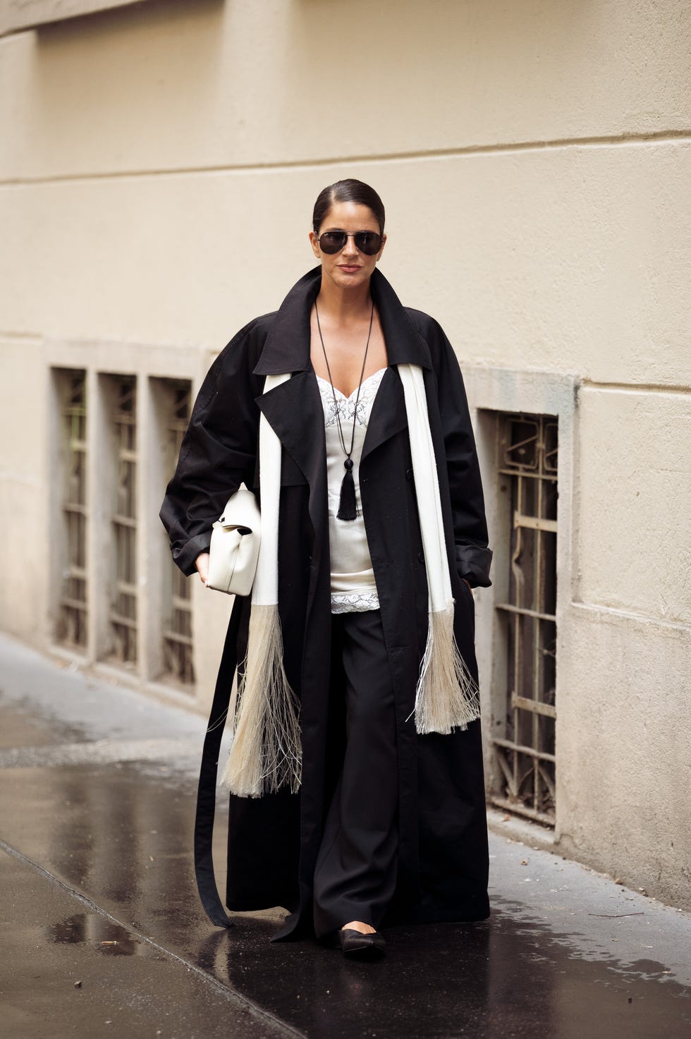 Long Black Coat with Dramatic White Scarf and Wide-Leg Pants — Long Coat Outfits