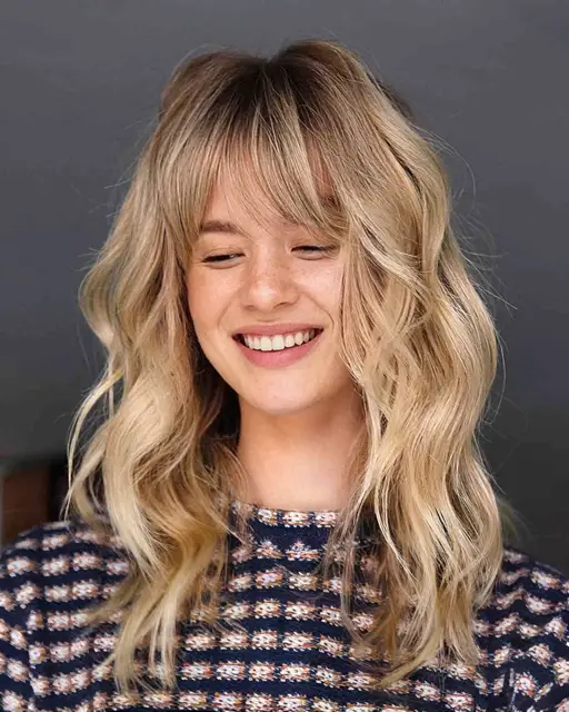 Shoulder-Length Haircut with Blunt Bangs Shoulder-Length Haircut with Blunt Bangs — Winter Haircuts for Oval Faces
