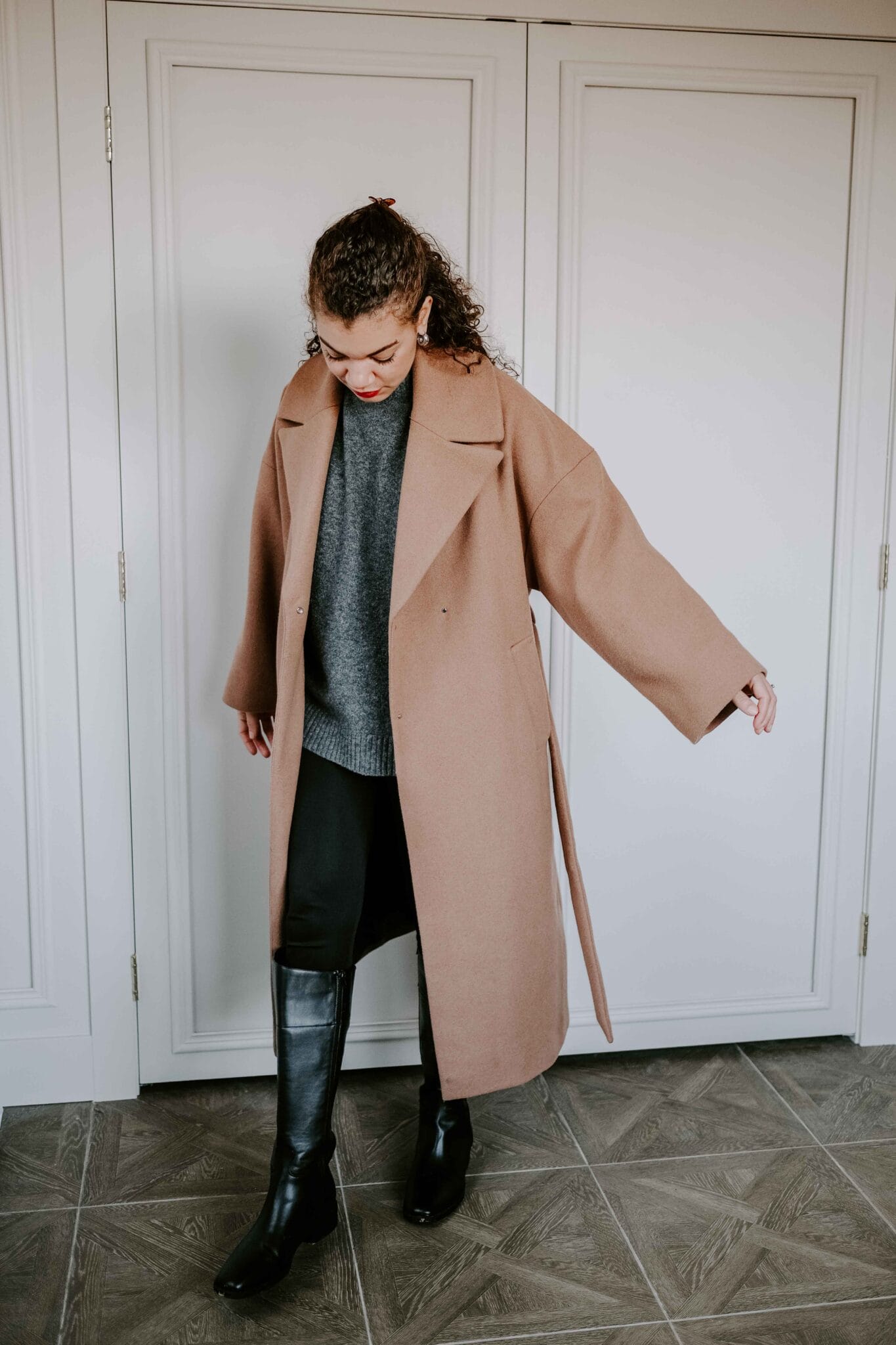 Riding Boots with Camel Coat and Sweater Vest Riding Boots with Camel Coat and Sweater Vest — Riding Boots Outfits