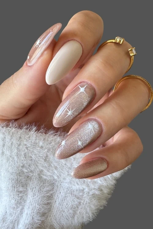Champagne Glitter Nails With Starburst Accents Champagne Glitter Nails With Starburst Accents — Neutral Nail Colors