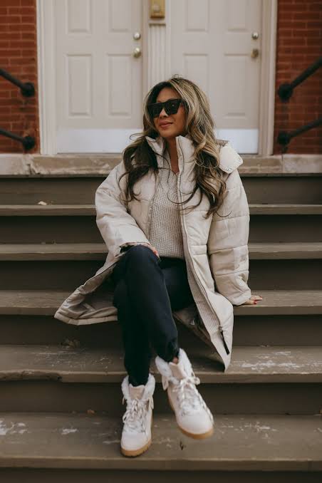 Off-White Puffer Coat Over Grey Zip-Up Sweater and Black Trousers — Neutral Winter Outfits