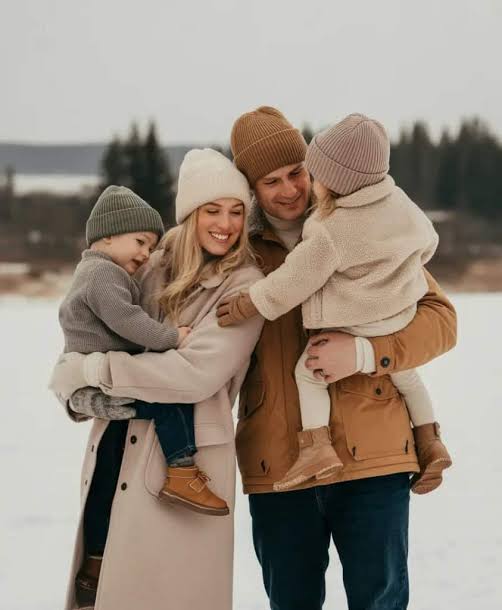 Coordinated Earthy Tones with Puffer Jackets and Knit Beanies — Winter Family Photo Outfits