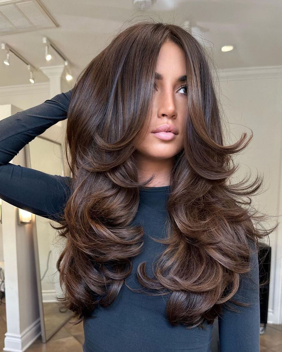 Rich Brown With Subtle Highlights Mid-Back Layers With Voluminous Waves Rich Brown With Subtle Highlights Mid-Back Layers With Voluminous Waves — Winter Haircuts for Wavy Hair