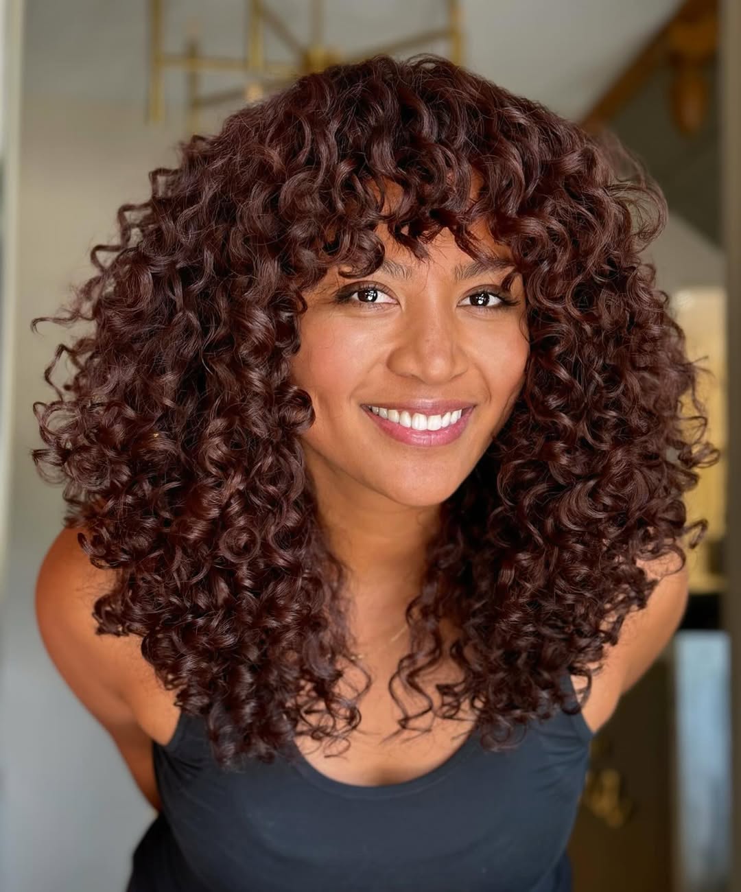 Collarbone Curls with Auburn Highlights — Winter Hairstyles for Curly Hair