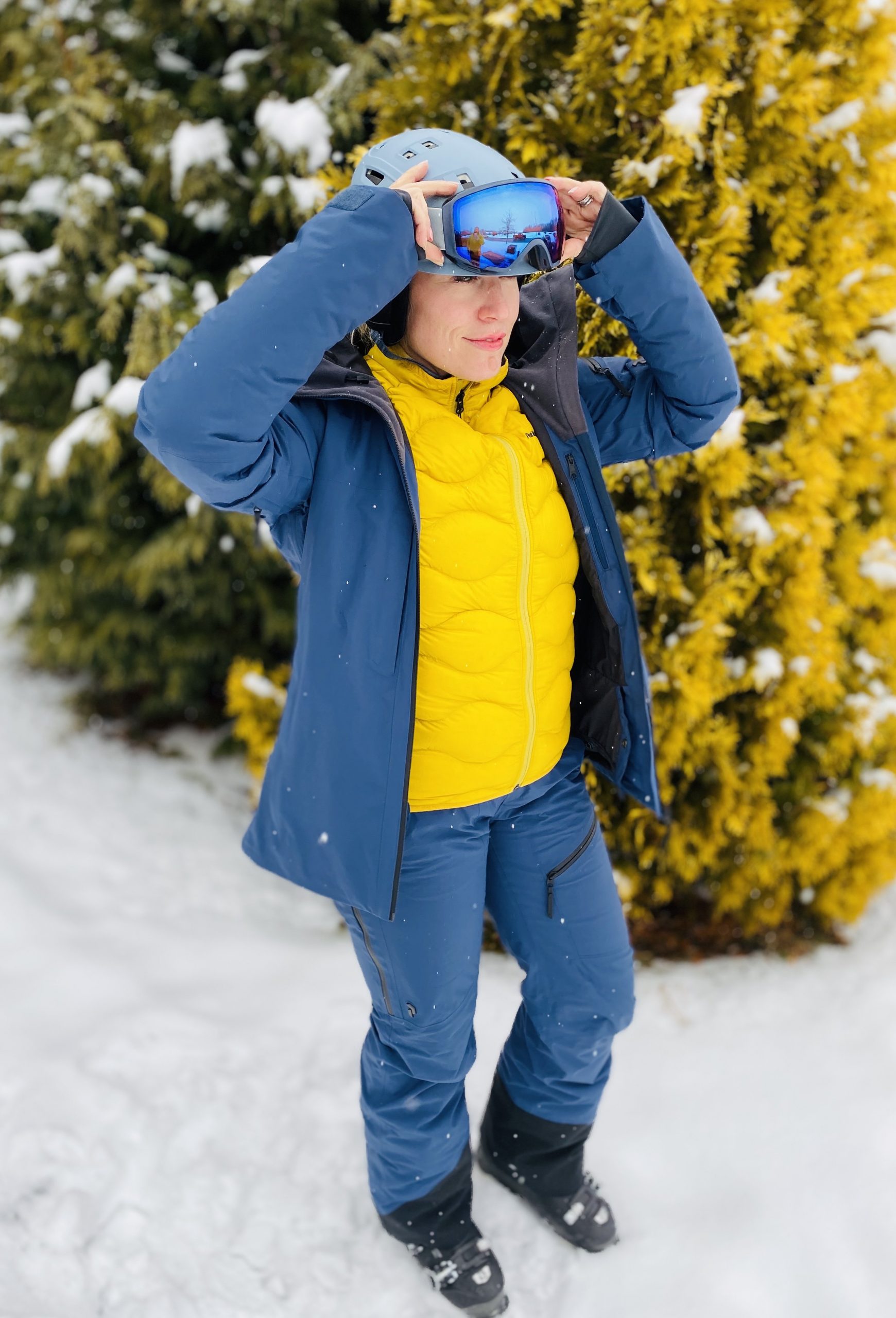 Blue Ski Jacket Layered Over Yellow Puffer Vest Blue Ski Jacket Layered Over Yellow Puffer Vest — Ski Outfits