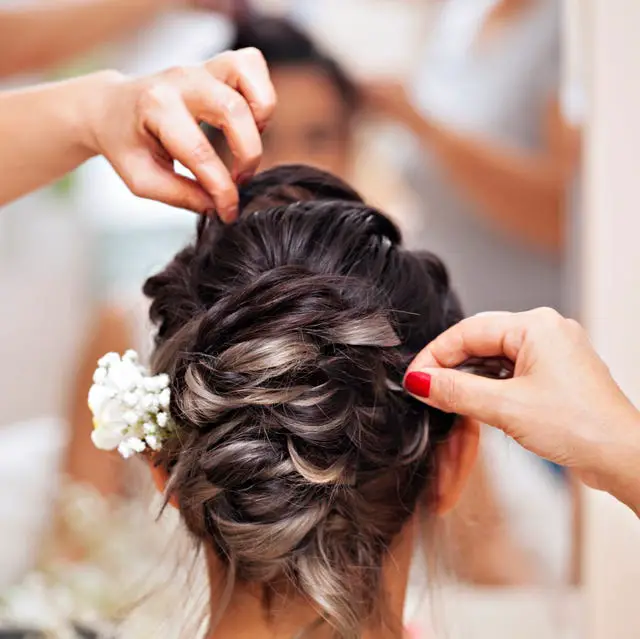 Dark Brown Braided Updo With Flowers Dark Brown Braided Updo With Flowers — Winter Wedding Hairstyles