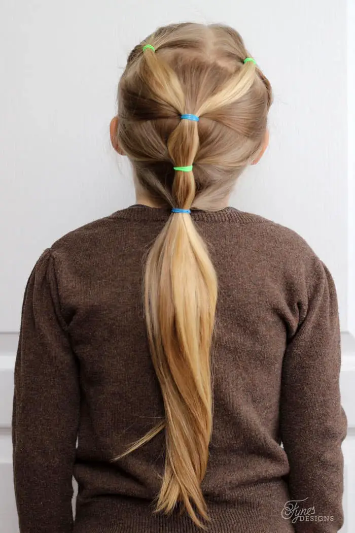 Blonde Ponytail With Twisted Star — Winter Hairstyles for School