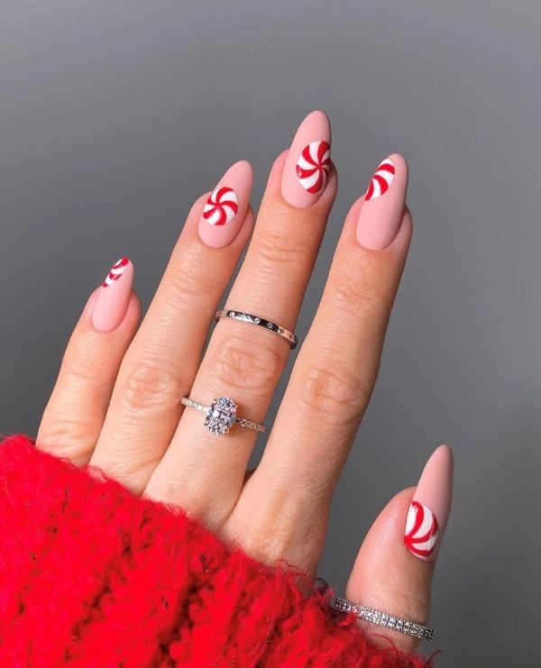 Matte Nude with Red Candy Cane Stripes Matte Nude with Red Candy Cane Stripes — Winter Nail Colors for Women Over 40
