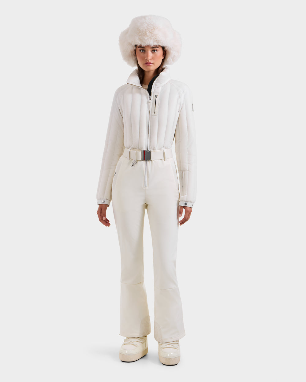 Chic White Ski Suit with Fur Hat Accent Chic White Ski Suit with Fur Hat Accent — Iceland Winter Outfits