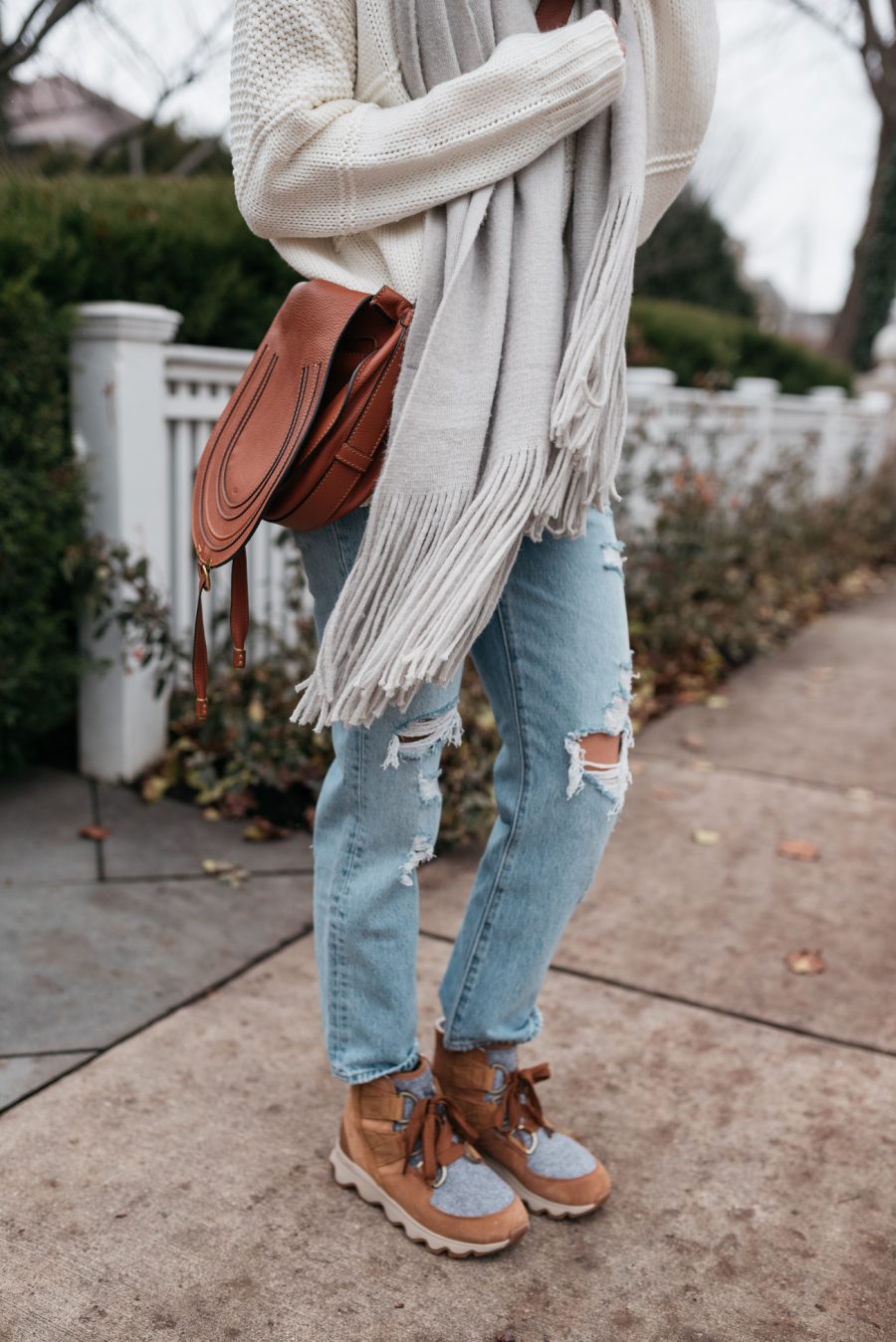 Distressed Denim and Tan Snow Boots with Cable-Knit Sweater Distressed Denim and Tan Snow Boots with Cable-Knit Sweater — Snow Boots Outfits