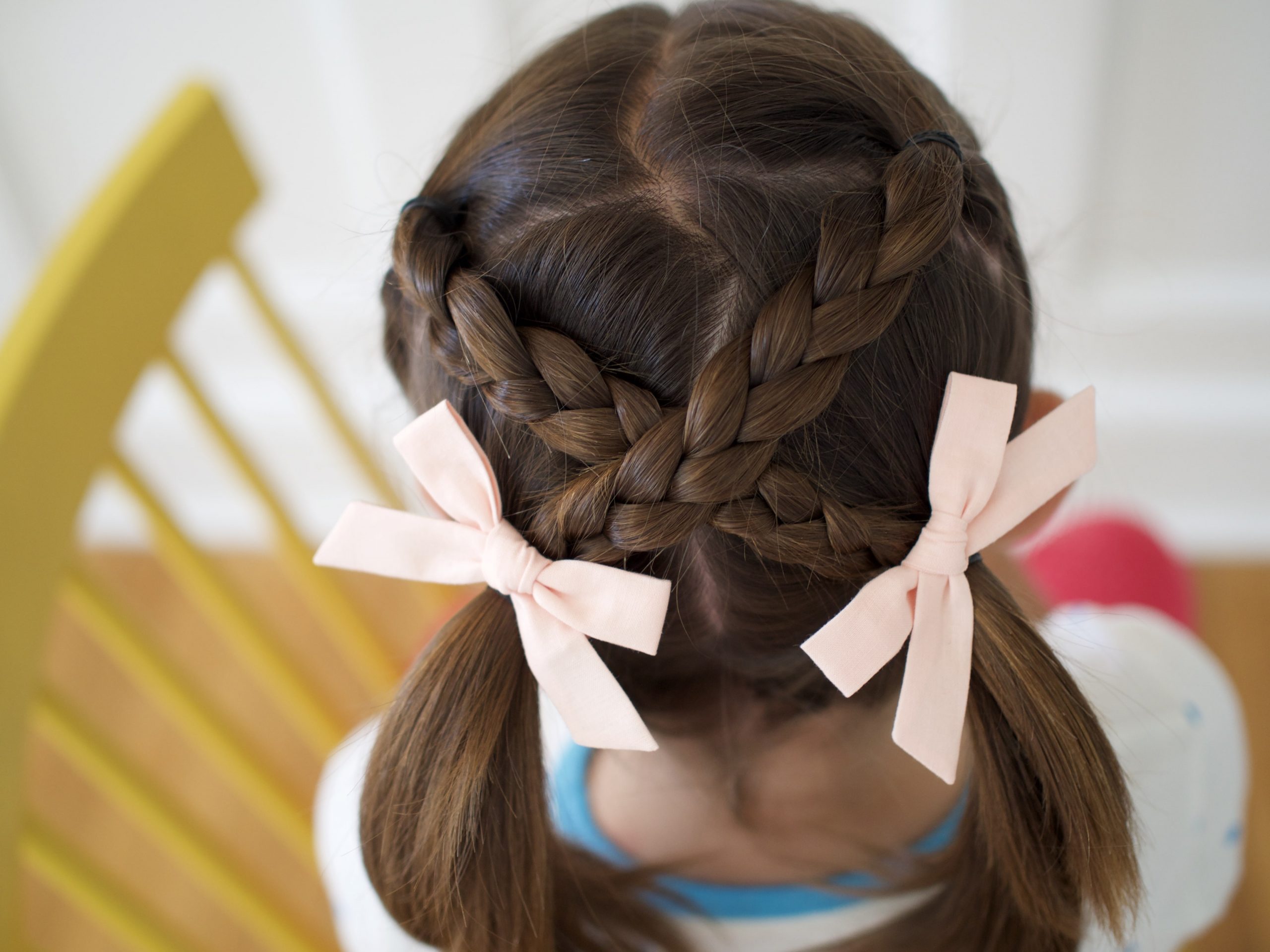 Pigtails With Braids and Bows — Winter Hairstyles for Kids