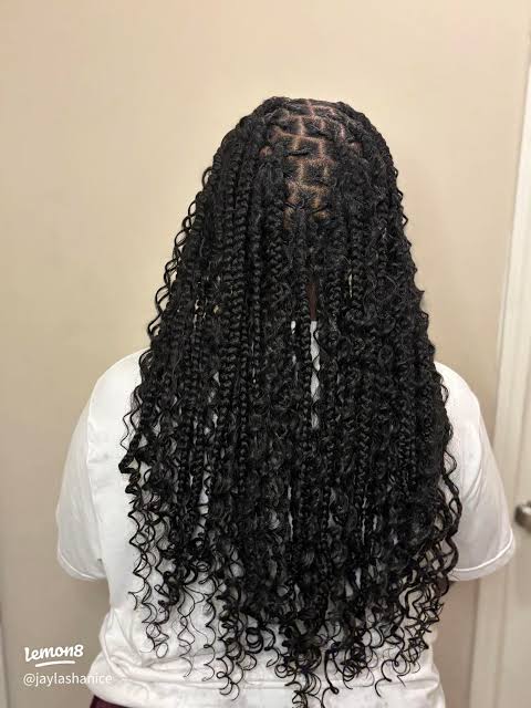 Black Braids With Abundant Tight Curls Black Braids With Abundant Tight Curls — Winter Knotless Braids