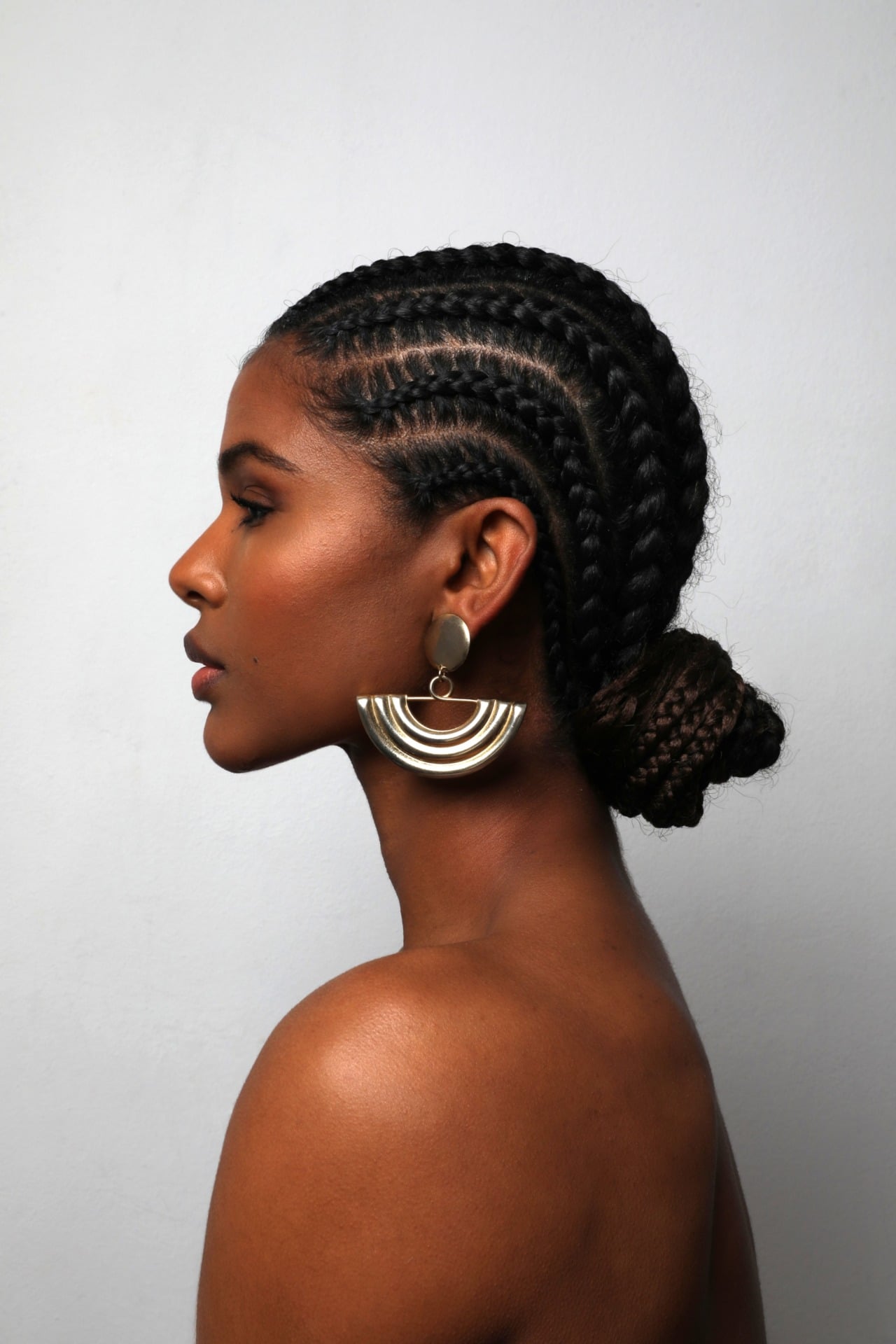 Black Cornrows Into Low Bun — Winter Protective Hairstyles