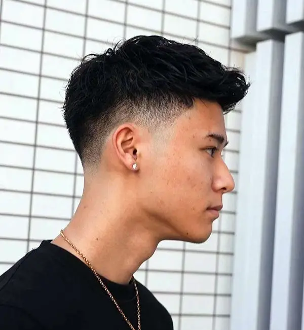 Black Taper Fade With Textured Quiff Black Taper Fade With Textured Quiff — Winter Haircuts for Boys