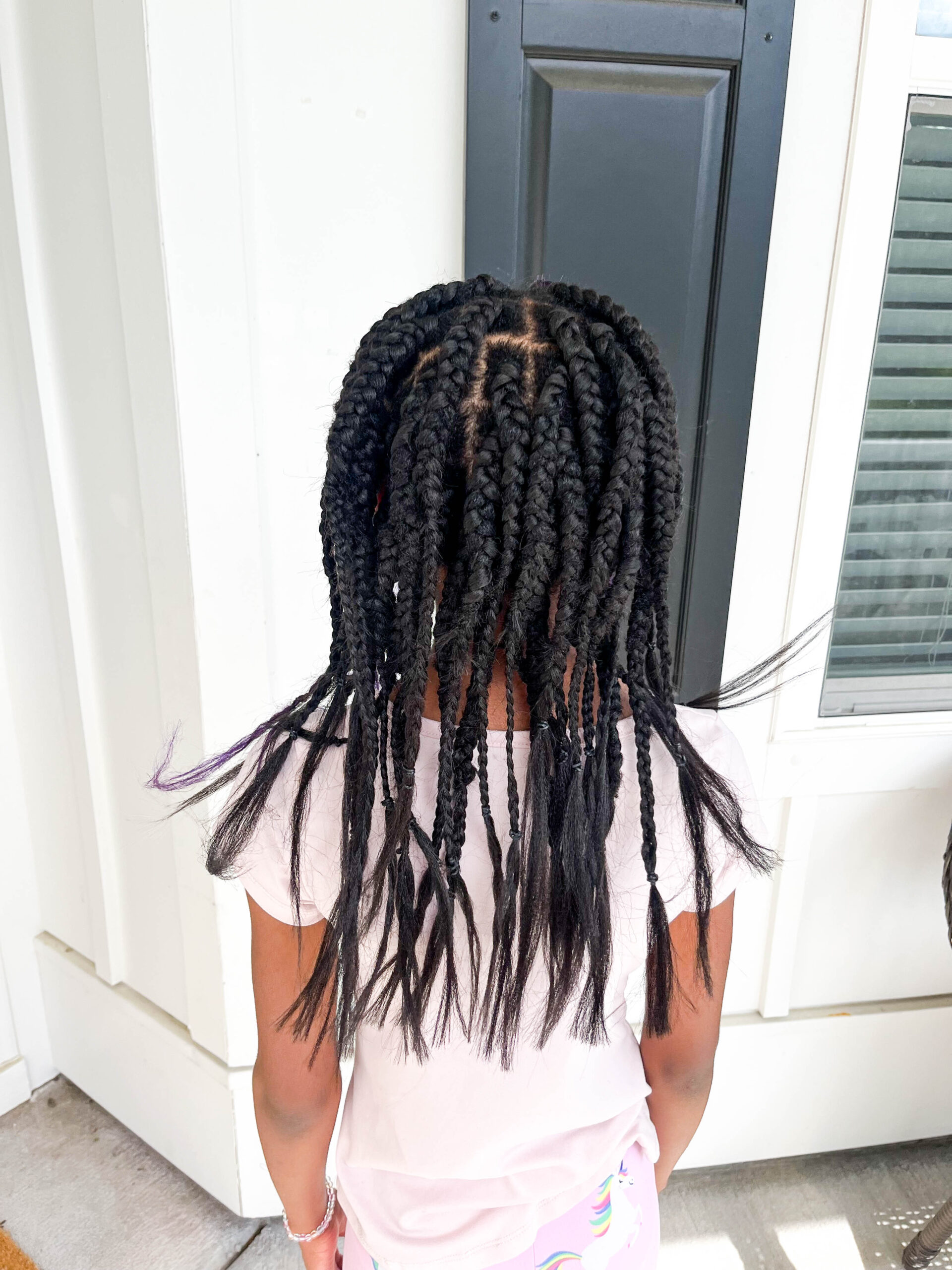 Mid-Back Visual Idea — Winter Hairstyles for Black Kids