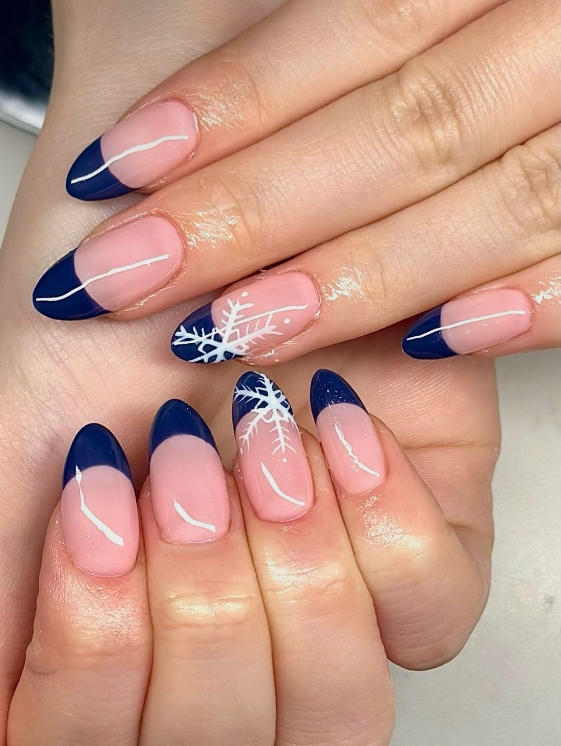 Navy French Tips with White Snowflakes Navy French Tips with White Snowflakes — Winter Almond Nails