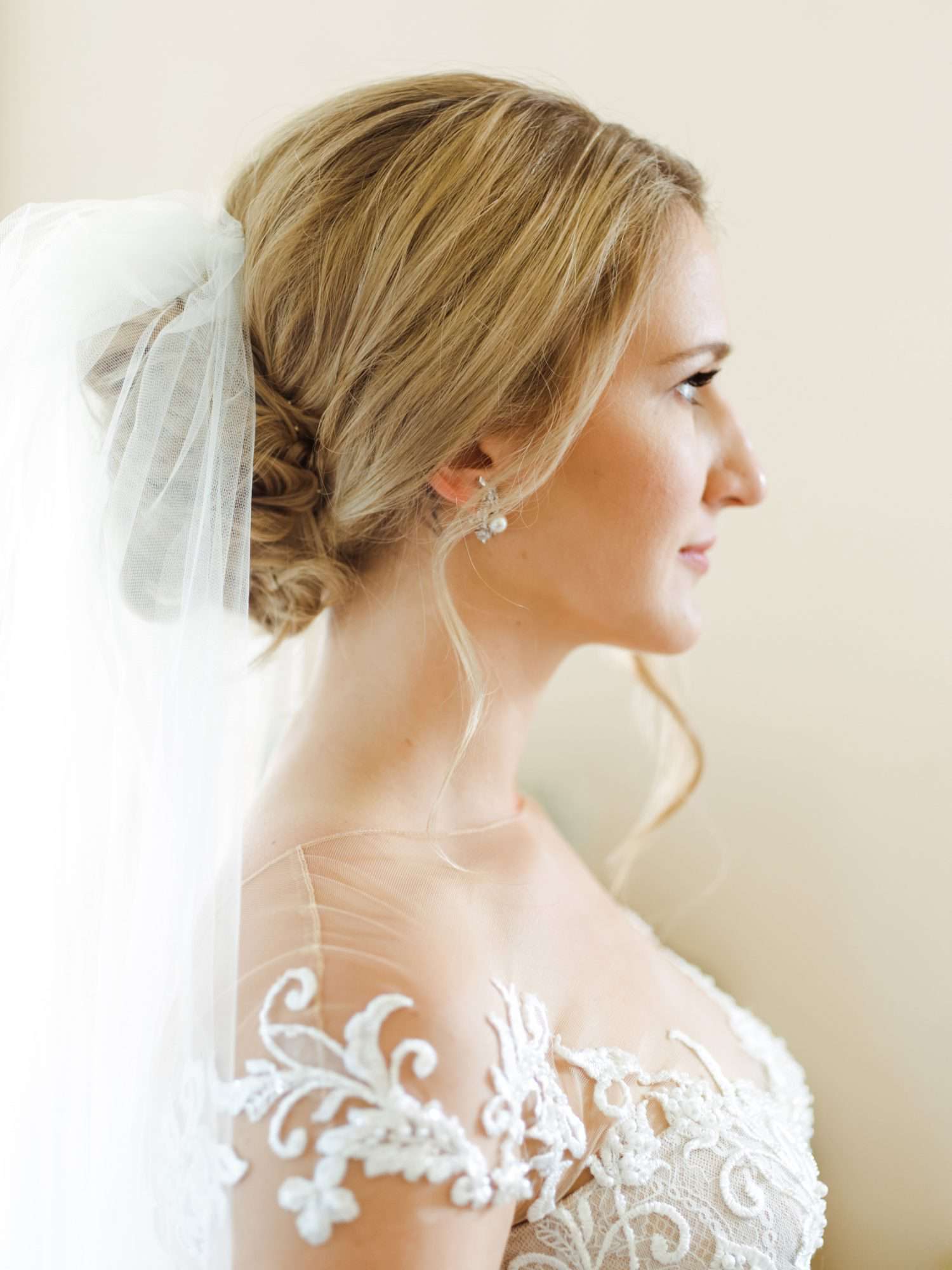 Blonde Low Bun With Braids and Veil Blonde Low Bun With Braids and Veil — Winter Wedding Hairstyles