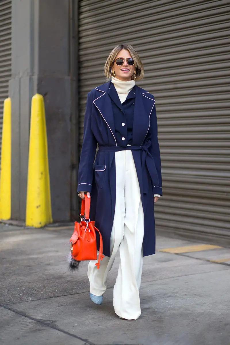 Chic Navy Belted Coat with White Trousers and Orange Bag Chic Navy Belted Coat with White Trousers and Orange Bag — Winter Layering Outfits