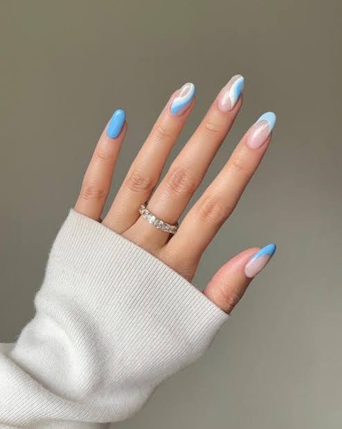 Abstract Wavy Blue And White Almond Nails Abstract Wavy Blue And White Almond Nails — Blue Nail Inspo
