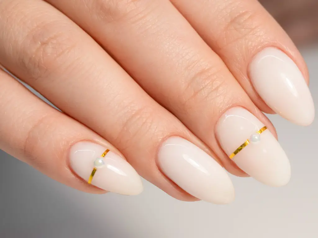 Creamy Off-White with Gold Stripe and Pearl Creamy Off-White with Gold Stripe and Pearl — Winter Nail Colors for Women Over 40