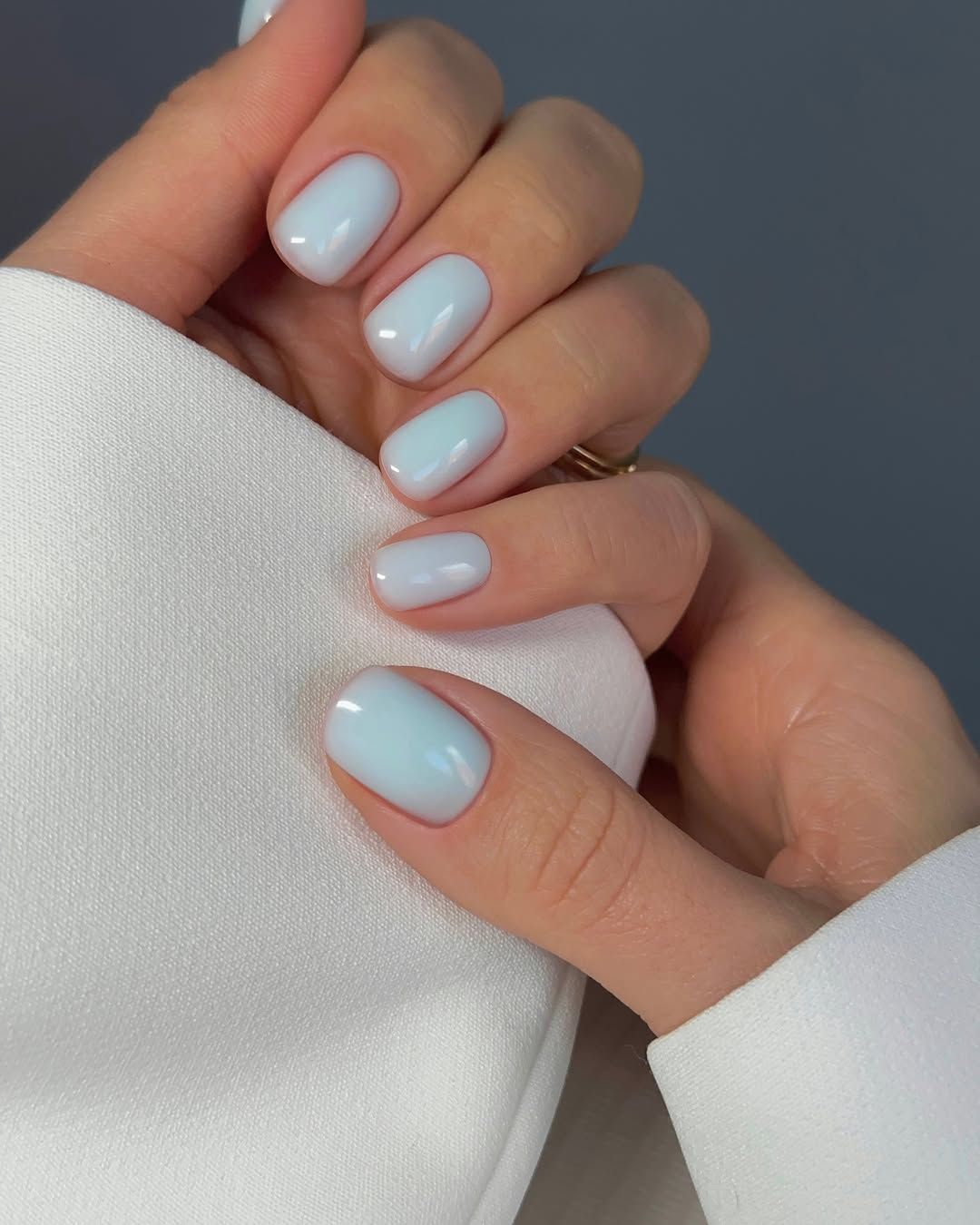 Light Pearlescent Blue Glossy Short Oval Nails Light Pearlescent Blue Glossy Short Oval Nails — Winter Nail Colors for Pale Skin