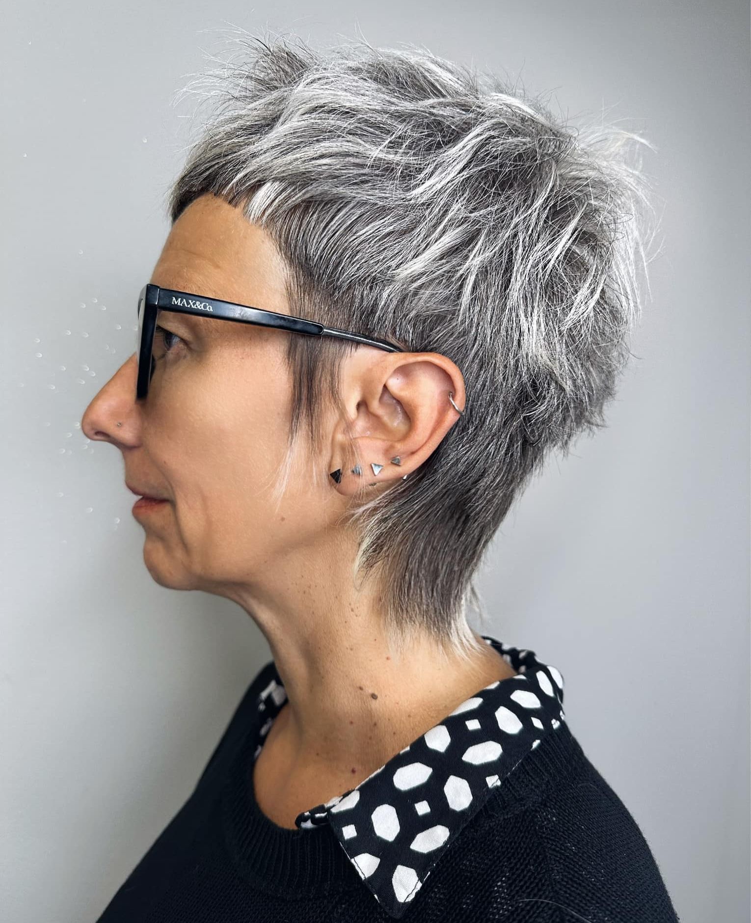 Textured Pixie With Gray and Silver Highlights Textured Pixie With Gray and Silver Highlights — Gray Blending Highlights