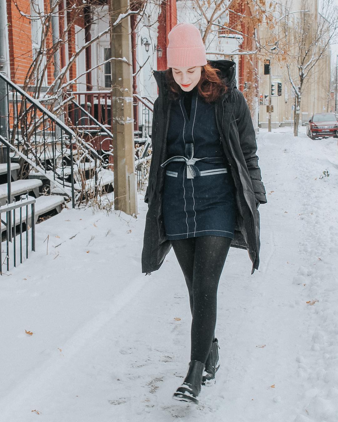 Black Puffer Coat Over Denim Dress for Winter Travel — Winter Travel Outfits