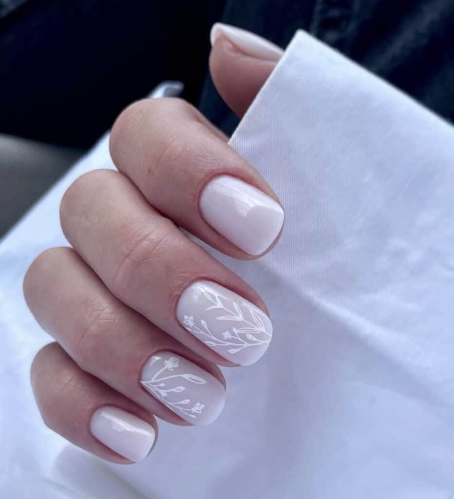 White Floral Vine Art On Accent Nails Visual Idea — Milky White Nails