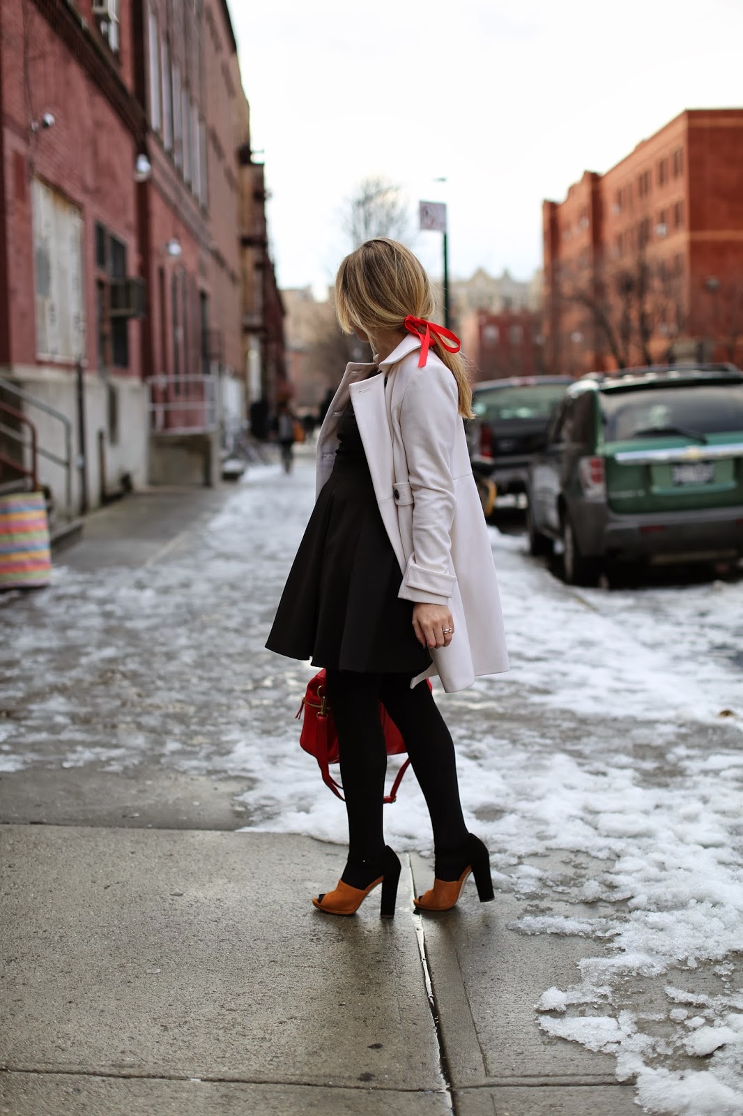 Cream Wool Coat Over Black Dress with Red Accents Cream Wool Coat Over Black Dress with Red Accents — Nashville Winter Outfits